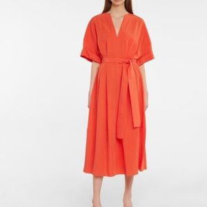 Vince Orange dress framed by cuffed sleeves